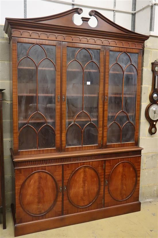 Charles Barr Furniture, A Sheraton-style mahogany library bookcase with swan-neck pediment, W.154cm, D.48cm, H.230cm